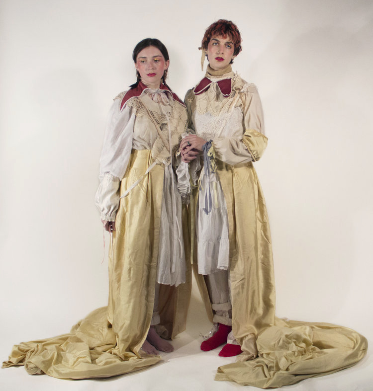 Mother Puce - Performance and Installation Mother Puce - Performance and Installation: Two people in long elaborate clothing